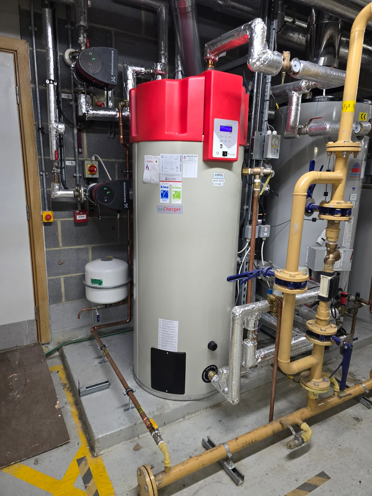 Commercial hot water boiler, pumps and insulated pipework